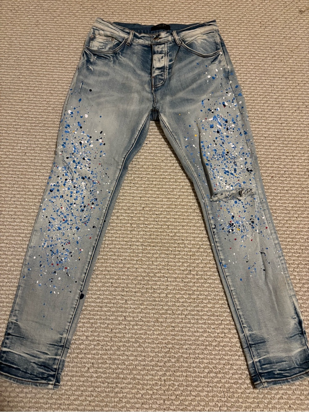 AMIRI Light Wash Skinny Jeans with Blue & White Paint Splatter